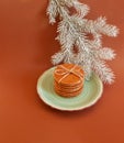 Dutch waffle stroopwafel background cookies round brown pastries plate blue christmas tree white yellow