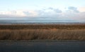 Dutch wide landscape with dike and winter sky, Waddensea Royalty Free Stock Photo
