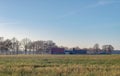 Dutch wide open farmland with farm in winter. Achterhoek. Gelderland. The Netherlands. Royalty Free Stock Photo