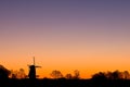 Dutch windmil at sunrise Royalty Free Stock Photo