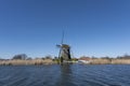 Dutch windmil an UNESCO world heritage site. Stone brick Windmill with water Royalty Free Stock Photo