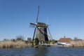 Dutch windmil an UNESCO world heritage site. Stone brick Windmill with water Royalty Free Stock Photo