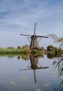 Dutch windmill alongside the canal Royalty Free Stock Photo