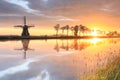 Dutch windmill during beautiful sunrise Royalty Free Stock Photo