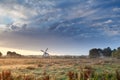 Dutch windmill and beautiful sunrise sky Royalty Free Stock Photo