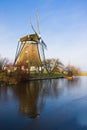 Dutch windmill in frozen polder landscape