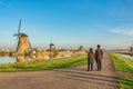 Dutch Windmill landscape at Kinderdijk Village Netherlands with love couple Royalty Free Stock Photo