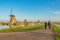 Dutch Windmill landscape at Kinderdijk Village Netherlands with love couple Royalty Free Stock Photo