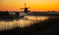 Dutch windmill with photographer in the mist Royalty Free Stock Photo