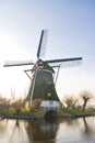 Dutch windmill in polder winter landscape Royalty Free Stock Photo