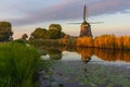 Dutch windmill reflected in the ditch Royalty Free Stock Photo