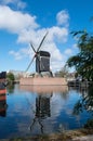 Dutch windmill reflecting in the river Rijn Royalty Free Stock Photo