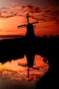 Dutch windmill Silhouette at sunset , Netherlands