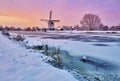 Dutch windmill in the snow of a holland winter Royalty Free Stock Photo