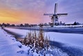 Dutch windmill in the snow of a holland winter Royalty Free Stock Photo