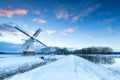 Dutch windmill in snow winter Royalty Free Stock Photo