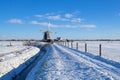 Dutch windmill during snowy winter Royalty Free Stock Photo