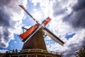 Dutch windmills with dramatic cloudy sky