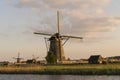 Dutch windmills (Kinderdijk) in sunset Royalty Free Stock Photo