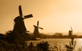 Dutch windmills silhouettes Royalty Free Stock Photo