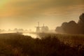 Dutch windmills at sunset Royalty Free Stock Photo