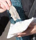 Dutch woman is eating typical raw herring