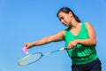 Dutch woman serve with badminton racket and shuttle