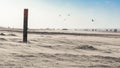 Dutch Wooden kilometer marker on the beach