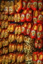 Dutch wooden shoes or wooden clogs, famous symbol of Netherlands, hanged in the shop