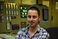 Duty engineer near control panel Royalty Free Stock Photo