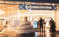 Duty free shop in International Doha airport, soft blurred. Boutiques in airport, defocused. Interior of airport building.