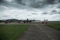 Duxford England May 2021 Distant view of the B 17 strategic world war two bomber on the duxford airstrip. Cloudy british skies.