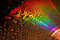 DVD and CD disc with water drops colour background. Royalty Free Stock Photo