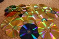 DVD and CD discs showing colorful backsides. Royalty Free Stock Photo