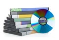 DVD, CD-ROM or Blu-Ray disc with stacked boxes for movies, audio or software on white Royalty Free Stock Photo