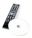 DVD, CD-ROM or Blu-Ray disc with tv or disc player remote control on white background. Home theatre movie or series concept Royalty Free Stock Photo