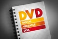 DVD - Digital Versatile Disk acronym on notepad, technology concept background
