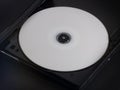 DVD with White Label in an Ejected DVD Player Tray Royalty Free Stock Photo