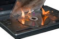 DVD player caught fire from the circuit, caught fire video device, fire in the apartment. On a white background, isolate. Royalty Free Stock Photo