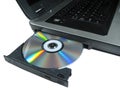 DVD ROM on a laptop opened to show disc. Isolated.