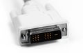 DVI plug, white cable closeup on white background, macro Royalty Free Stock Photo