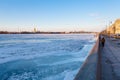 Dvortsovaya Embankment along frozen Neva river Royalty Free Stock Photo