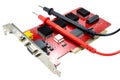 DVR motherboard with the probes of the multimeter on a white background