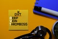 DVT. Deep Vein Thrombosis acronym on sticky notes. Office desk background