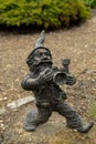 Dwarf with camera - photographer. Small bronze figures of gnomes on the streets of Wroclaw. Europe Miniature bronze
