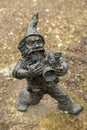 Dwarf with camera - photographer. Small bronze figures of gnomes on the streets of Wroclaw. Europe Miniature bronze