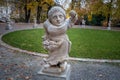 Dwarf Garden Zwergerlgarten - Dwarf with fruit pinafore representing month of september - 17th century statue - Salzburg,