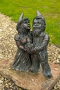 Dwarf wedding couple. Small bronze figures of gnomes on the streets of Wroclaw. Europe Miniature bronze figure of a