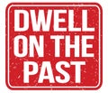 DWELL ON THE PAST, text written on red stamp sign