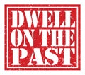 DWELL ON THE PAST, text written on red stamp sign